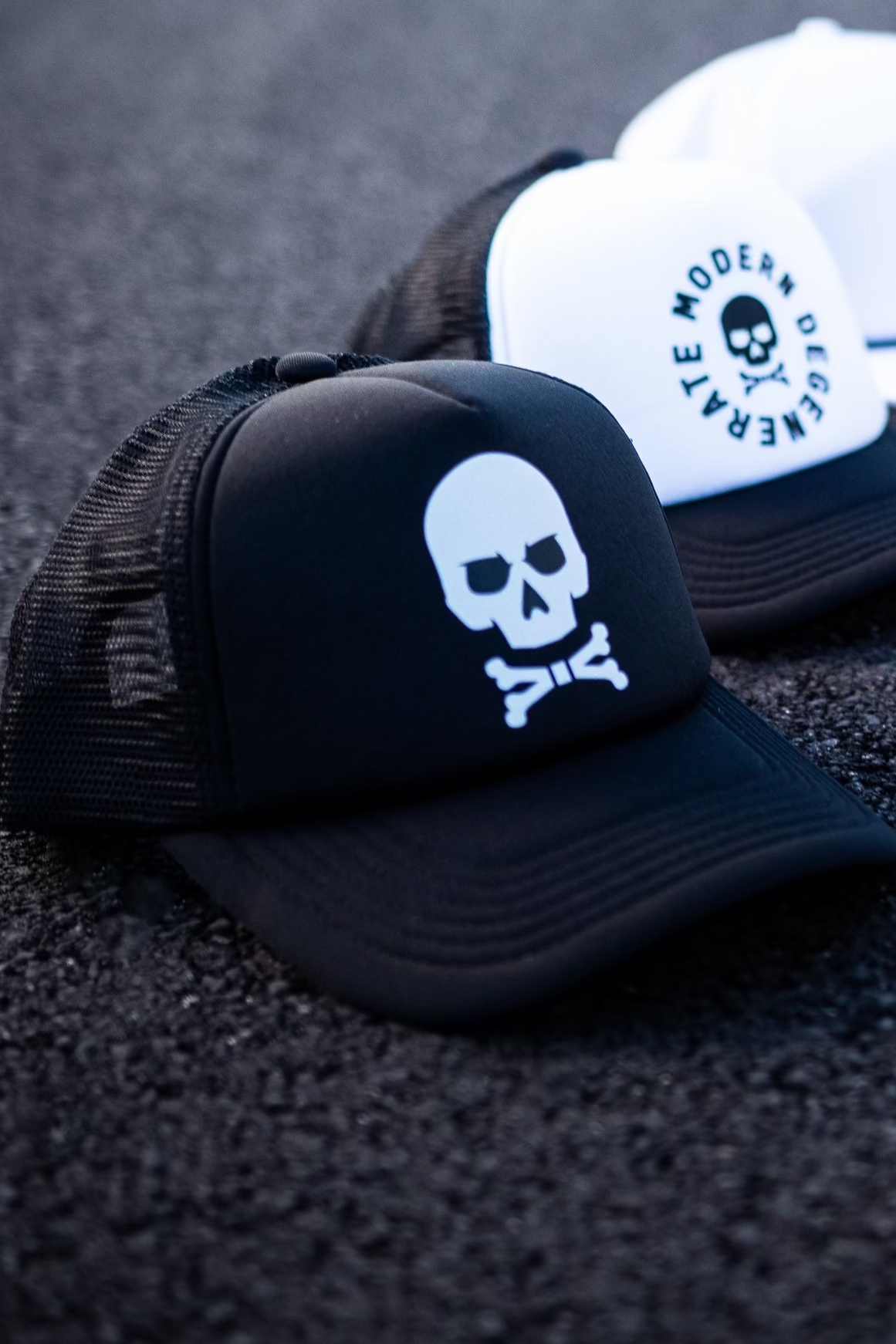 A black trucker cap with a skull and crossbones