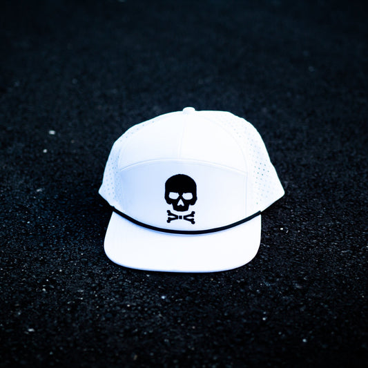 A white flat brim hat with a black skull and crossbones. 